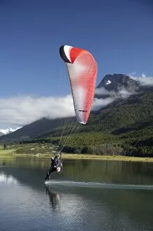 Images Dated 21st December 2007: Paramotor skimming water, Diamond Lake, Paradise, near Glenorchy, Queenstown Region