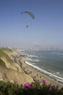 Lima Prints: Parasailor soars over cliffs and ocean in Miraflores neighborhood, Lima, Peru