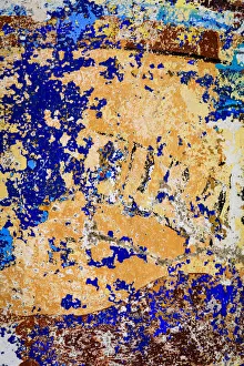 Peeling, weathered paint. Blue and orange