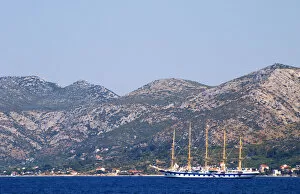 The Peljesac peninsula and Sveti Ilija mountain with a big sailing cruise ship schooner