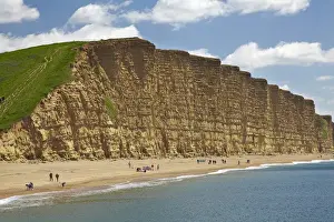 England Prints: People on beach by West Bay Cliffs, Jurassic Coast World Heritage Site, West Bay