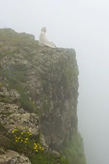 Amhara Prints: People on the cliff in morning mist, Simien Mountain, Ethiopia