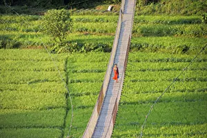 Rice Paddy Prints: People crossing suspension bridge over Trishuli River, Tupche, Nuwakot District