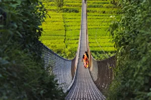 People crossing suspension bridge over Trishuli River, Tupche, Nuwakot District