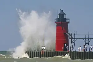 Images Dated 14th July 2008: People on jetty watch large breaking waves in South Haven Michigan