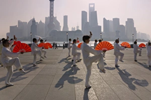 Shanghai Prints: People practicing Taiji with red fans on the Bund in the morning, Pudong skyline