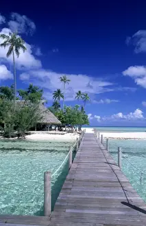 Walk Way Prints: The perfect scene of wooden dock walkway over water in beautiful Tahiti in Bora Bora