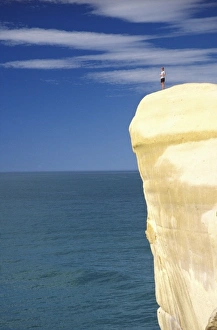 Surreal Prints: Person on cliff top, Tunnel Beach, Dunedin, New Zealand