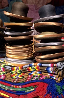 Images Dated 10th March 2006: Peru. Pile of felt hats with satin rims on a pile of woven mantas