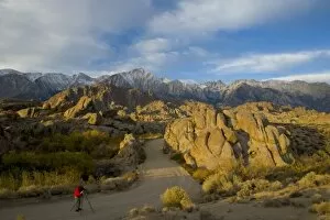 Images Dated 13th November 2005: Photographer in the Roadway Alabama Hills California with a backdrop of the Eastern