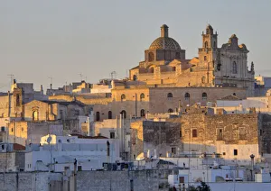 Basilica Prints: The picturesque old town of Ostuni in southern Italy, built on top of a hill and crowned