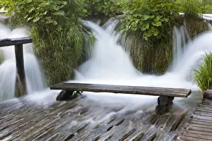 The Plitvice Lakes in the National Park Plitvicka Jezera in Croatia. Bench in water