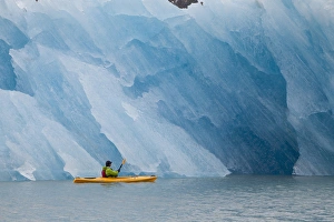 Kayaker Prints: Port Nellie Juan, Prince William Sound, Alaska, a kayaker pauses to look at a magnificent