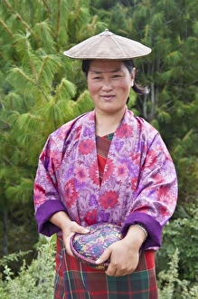 Portrait of a farmer wearing bamboo hat, Bumthang, Bhutan. (MR)