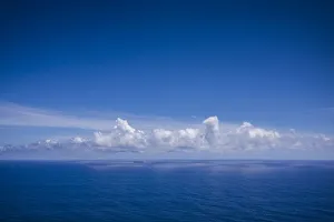 Images Dated 24th May 2017: Portugal, Azores, Santa Maria Island, Ponta do Castelo. Elevated seascape with freighter