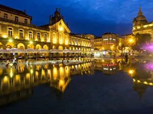 Town Square Prints: Portugal, Braga. Sunset along the sidewalk of cafe and town square at dusk, Praca