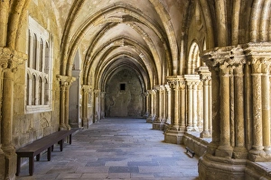 Portugal, Coimbra. Old Cathedral cloister. Archways, walking paths, courtyard