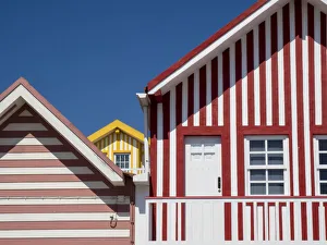 Images Dated 21st December 2020: Portugal, Costa Nova. Colorful houses Palheiros striped homes