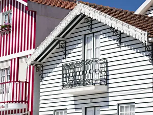 Images Dated 21st December 2020: Portugal, Costa Nova. Colorful houses Palheiros striped homes