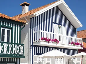 Images Dated 21st December 2020: Portugal, Costa Nova. Colorful houses Palheiros striped homes