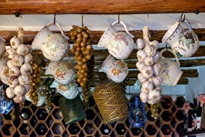 Portugal, Lisbon. Ceiling decor and wine bottles. Parreirinha de Alfama Restaurant