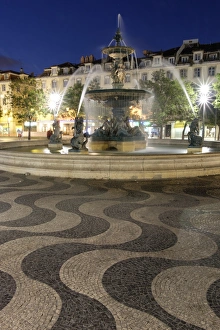 Rossio Square Prints: Portugal, Lisbon. Rossio Square at night. Bronze Mermaid Fountain
