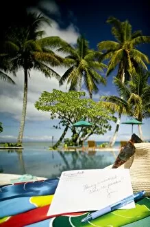 Postcard, pen, hat and glasses. Beautiful tropical holiday at Beqa Lagoon Resort