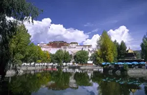 Tibet Prints: Potala Palace on mountain the home of the Dalai Lama with lake in capital city of