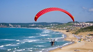 Images Dated 9th June 2007: Powered paraglider flying over Gumusdere beach on the Black Sea coast of Istanbul