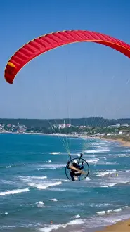 Adventurous Prints: Powered paraglider flying over Gumusdere beach on the Black Sea coast of Istanbul