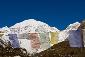 Images Dated 12th November 2006: Prayer flags and Mount Jhomolhari, Bhutan