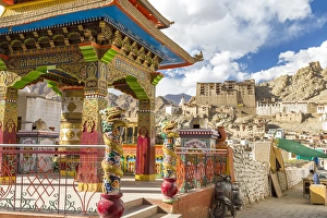 Ladakh Prints: Prayer wheel & Leh Palace in background, Leh, Ladakh, India