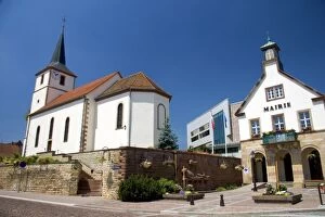 Protestant church and municipal offices at the village of Betschdorf, France