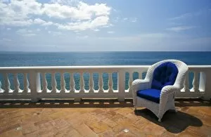 Puerto Rico. Wicker chair and tiled terrace at the Hornet Dorset Primavera Hotel