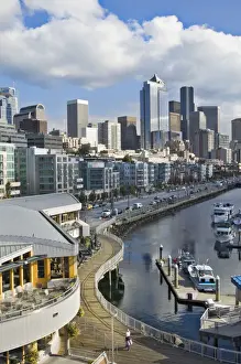 Images Dated 20th October 2006: Puffy clouds over Seattle, Washington skyline seen from Elliot Bay with boats in the foreground
