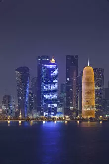 Qatar Collection: Qatar, Doha, Doha Bay, West Bay skyscrapers dawn, with World Trade Center in blue