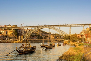 Images Dated 26th August 2024: Rabelo boats near the Luis I Bridge over the Douro River, Porto, Portugal