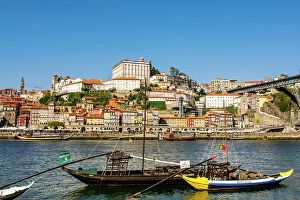 Images Dated 26th August 2024: Rabelo boats near the Luis I Bridge over the Douro River, Porto, Portugal