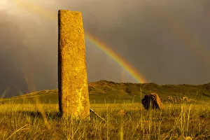 Mongolia Collection: Rainbow over Deer stones with inscriptions, 1000 BC, Mongolia