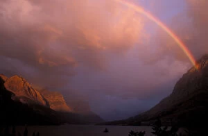 Rainbow and stormy sunrise over St. Mary Lake in Glacier National Park, Montana