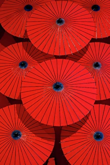 Kyoto Prints: Red paper parasols on display, Arashiyama, Kyoto, Japan