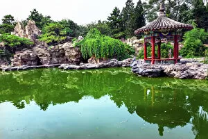 China Gallery: Red Pavilion Rock Garden Water Pond Reflection Temple of Sun City Park, Beijing
