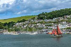 Images Dated 13th July 2024: Red sailboat sailing, Dartmouth, Kingswear, Devon, England