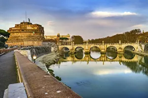 Red wall of St. Angelo Bridge, Tiber River reflection, Rome, Italy