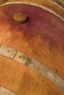 Red wine stain around cork of French oak barrel at Sokol Blosser Winery near Dundee, Oregon, USA