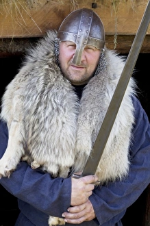 Holding Prints: Reenactor as sword-wielding Viking Erik the Red, the father of Leif Eriksson
