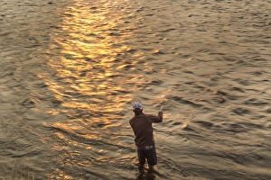 Lifestyle Prints: Reid Sabin fly fishing at sunrise on the Madison river near Ennis, Montana, USA (MR)