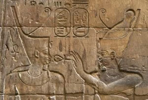 Relief depicting Egyptian divinity giving the Ankh to a pharaoh. Temple of Luxor. Egypt
