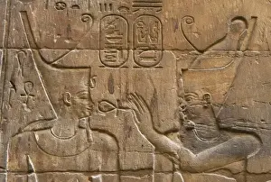 Egypt Prints: Relief depicting Egyptian divinity giving the Ankh to a pharaoh. Temple of Luxor. Egypt