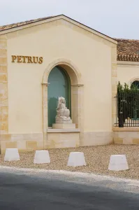 Domain Prints: Renovated Chateau Petrus with a sign with the name in gold and a stone statue of